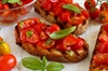 Sunlit Garden Bruschette with Juicy Tomatoes and Fresh Basil